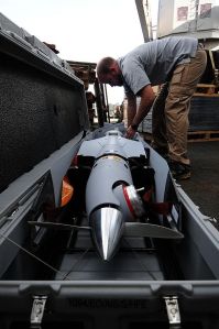110225-N-RC734-011 PACIFIC OCEAN (Feb. 25, 2011) Guy Mcallister, from Insitu Group, performs maintenance on the Scan Eagle unmanned aerial vehicle (UAV) aboard the amphibious dock landing ship USS Comstock (LSD 45). Scan Eagle is a runway independent, long-endurance, UAV system designed to provide multiple surveillance, reconnaissance data, and battlefield damage assessment missions. Comstock is part of the Boxer Amphibious Ready Group, which is underway in the U.S. 7th Fleet area of responsibility during a western Pacific deployment. (U.S. Navy photo by Mass Communication Specialist 2nd Class Joseph M. Buliavac/Released)